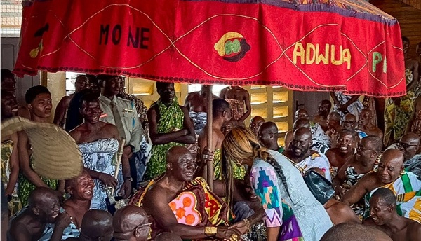 Asantehene, Otumfuo Osei Tutu II shakes hands with granddaughter Amma Prempeh