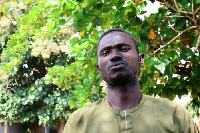 Mubarak Dahiru, second left, and fellow survivors pose in Minna