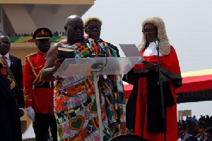 Akufo-Addo being sworn into office by the retired Justice Georgina Theodora Wood