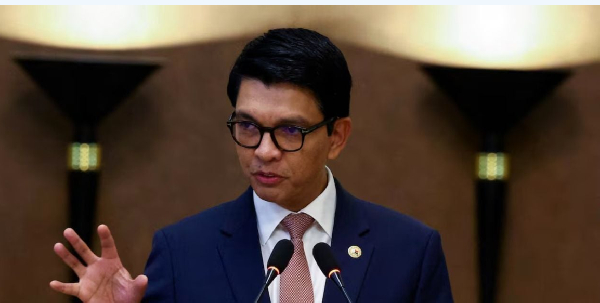 Andry Rajoelina, gestures as he appoints military gen. Ruphin Fortunat Zafisambo as Prime Minister