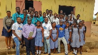 Officials of the NGO pose with the students after the mentorship session