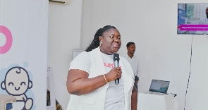 Dr. Karen Amaniampong addressing a health fair.