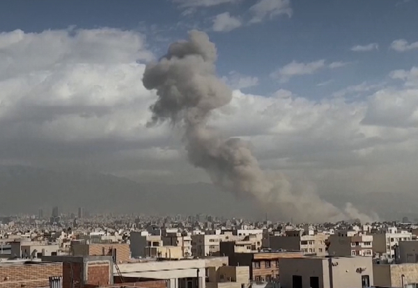 Smoke can be seen in the centre of the city