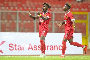 Asante Kotoko striker Steven Mukwala celebrating with Enoch Morison