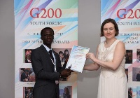 Ghanaian Diplomat , Steven Blessing Ackah receiving his award