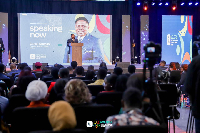 Daniel Asomani speaking to the audience