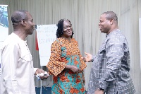 Ms Marilyn Aniwa (middle), Coordinator, PIAC, interacting with Mr Roland Affail Monney (left)