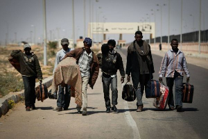 A picture of immigrants carrying their luggages