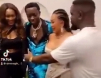Michael Blackson with his fiancée in a group picture with Sarkodie and his wife, Tracey