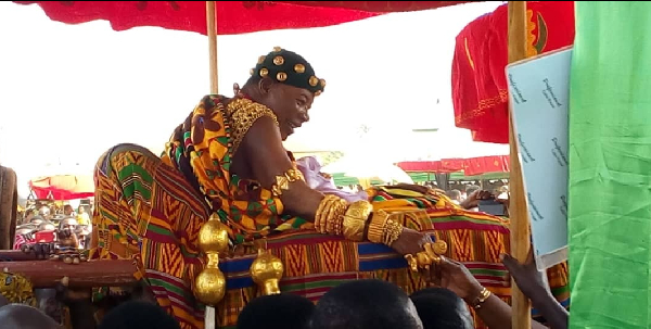 A chief in a palanquin