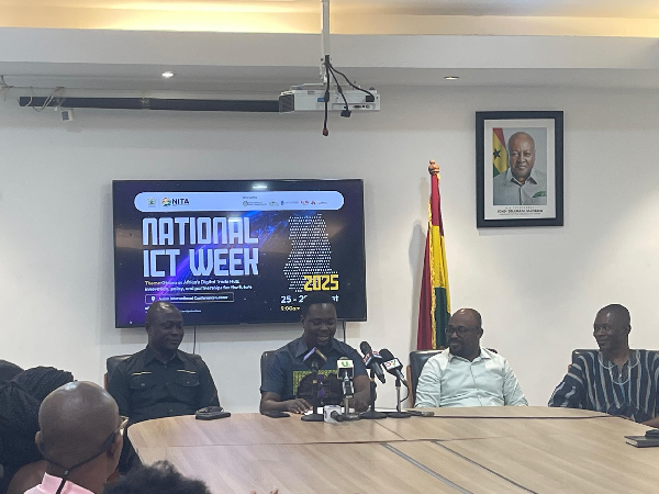 Dr Mark-Oliver Kevor (middle) addressing the media