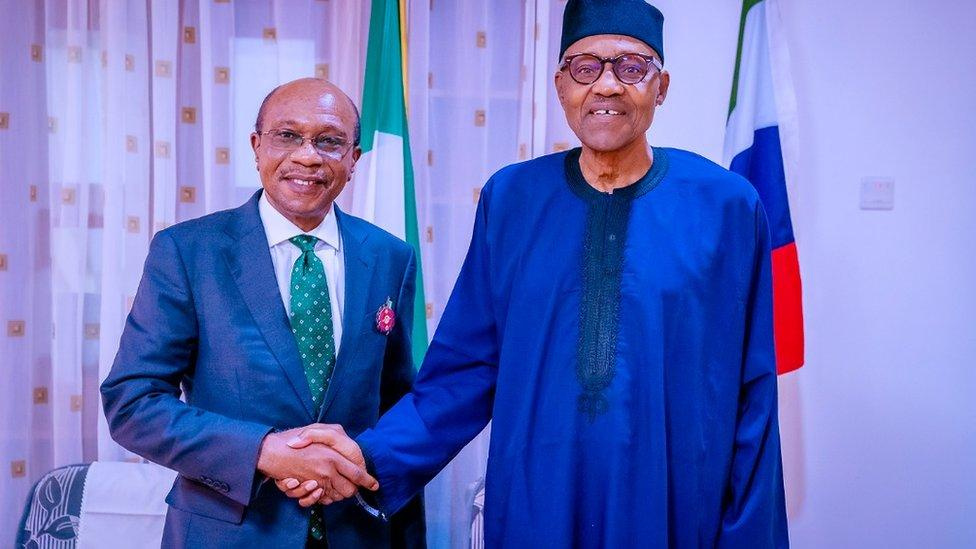 CBN govnor Godwin Emefiele plus Presido Muhammdu Buhari