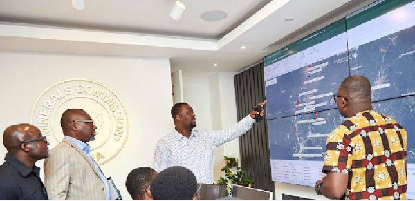 Julius Neequaye Kotey making a point in Mineral Commission room for tracking excavators