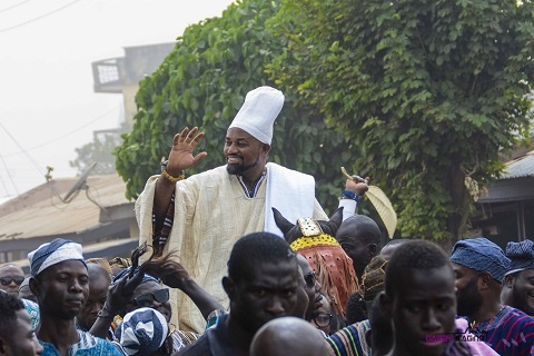 Gugba Naa, Daniel McKorley acknowledges cheers during a procession through the streets of Tamale