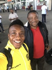 Goalkeeper Felix Annan with coach Fabin at the airport