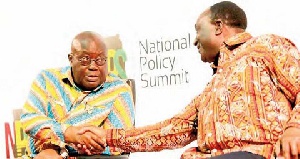 President Akufo-Addo in a handshake with Alan Kyerematen (right) Minister of Trade and Industry