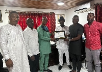 Dr. Abdulai (third from left) receiving the citation from Hausa Youth Ghana