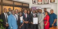 Kwame Owusu-Boateng (CEO of Opportunity International Savings and Loans Ltd.)displaying the award