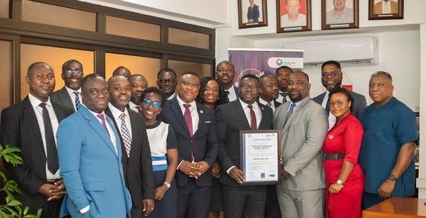 Kwame Owusu-Boateng (CEO of Opportunity International Savings and Loans Ltd.)displaying the award