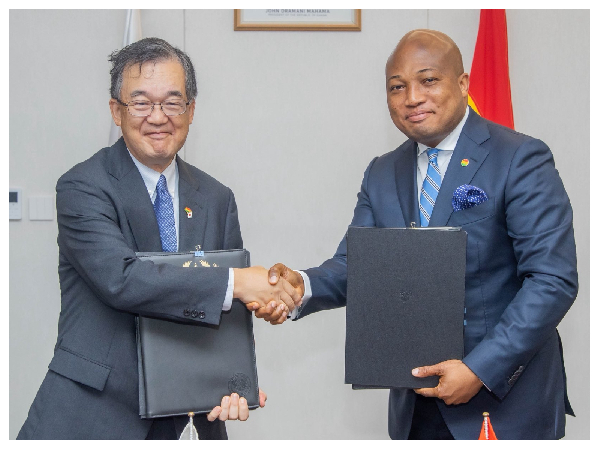 Hiroshi Yoshimoto with Samuel Okudzeto Ablakwa during the signing of the agreement