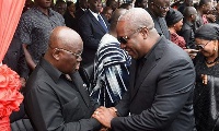 President Mahama (right) in a handshake with Nana Akufo-Addo