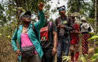 Iroro Tanshi briefs her team before bat trapping in Etankpini village, Cross River State