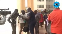 The Police officer in a scuffle with David Andoh over the latter's camera
