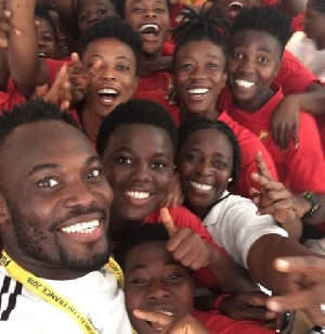 Michael Essien with some of the players before their game against France