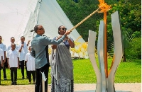 Rwandan President Paul Kagame and First Lady Jeannette Kagame light the Flame of Hope