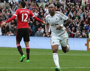 Ghana winger Andre Ayew celebrating one of his goals against Manchester United