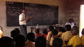 A photo of a teacher in a classroom