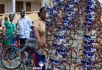 Sammi Awuku presenting the bicycles to the beneficiaries