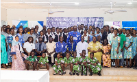 Student pose for a photo with teachers