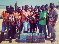 Team Volta receiving the donation