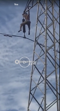 Man climbs high-tension pole in Kasoa