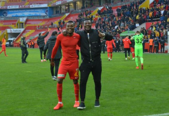 Bernard Mensah celebrates with Gyan after the game