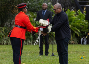 President John Dramani Mahama (in black) receiving flowers