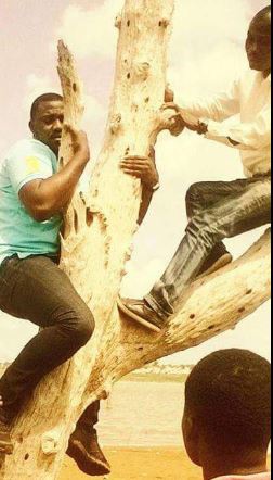 Actor John Dumelo spotted on a tree hanging NDC flag