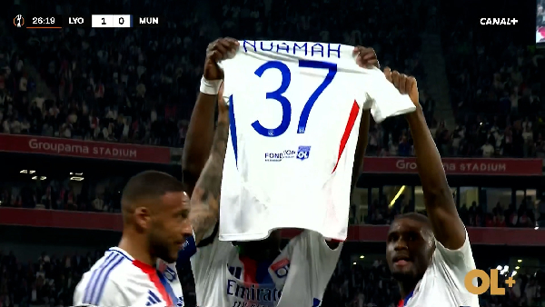 Niakhaté (M) and Lyon teammates showing love to Nuamah