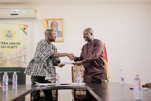Mr. Hayford Siaw with Mr. Rene Gameli-Kwame after signing the deal