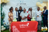 Prof. Philip Odonkor, Pro CV Family Health University (3rd R) to cut cake