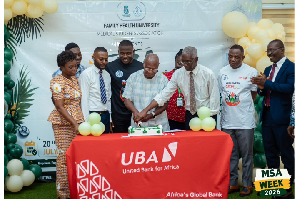 Prof. Philip Odonkor, Pro CV Family Health University (3rd R) to cut cake