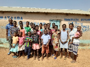 Group photo of caretakers and the children