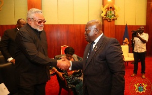 Former president Rawlings and Akufo-Addo interacting at an event