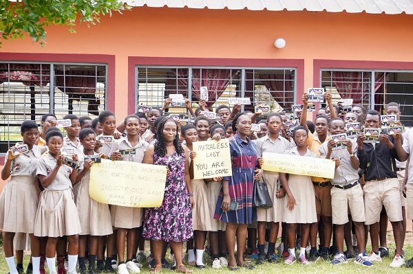 Eleanor Effe Amanor in a photo with some studens