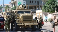 Security forces take security measures at the area after bomb attack