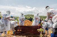 Red Cross workers bury an Ebola victim in Rwampara, DR Congo, 23 May 2026