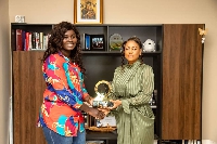 Angela List  receiving the award from CEO of ASKOF Productions Limited Mrs Afua O. Aduonum