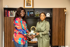 Angela List  receiving the award from CEO of ASKOF Productions Limited Mrs Afua O. Aduonum