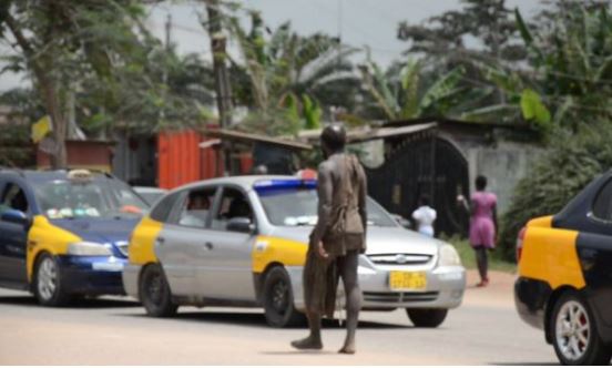 Mental patient walks in the middle of a street.